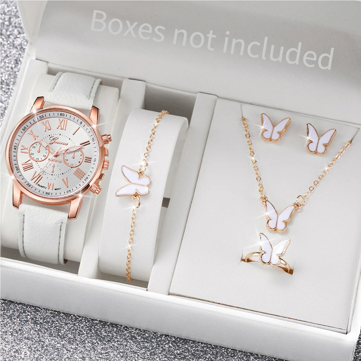 Wakefresh women's quartz wristwatch with leather band and rhinestone accents, paired with matching jewelry set.