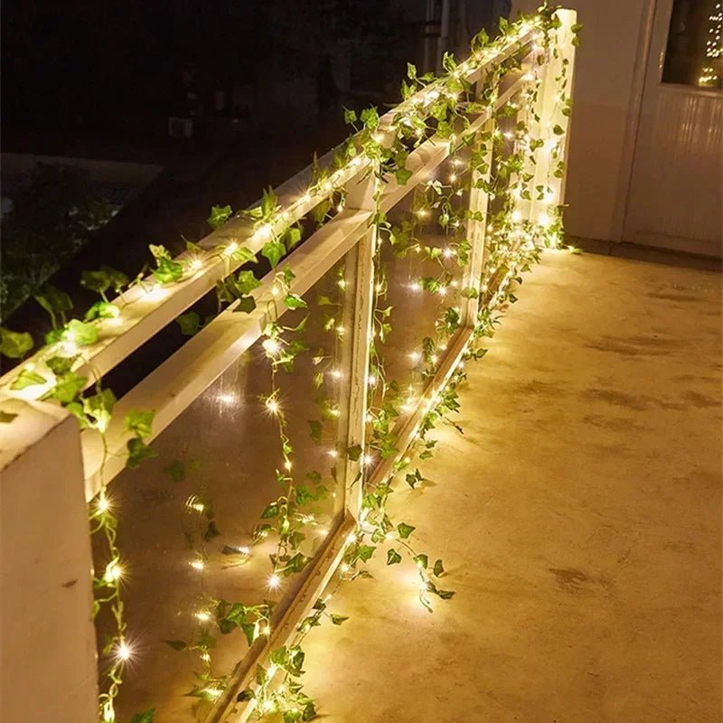 Wakefresh green leaf string lights with 20 LED bulbs on artificial vine, battery-powered garland for Christmas, wedding, and home decor.